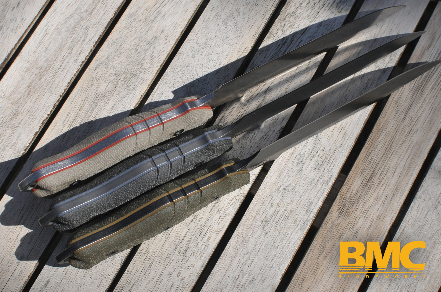 BMC M28 knives showing the various micarta handle options