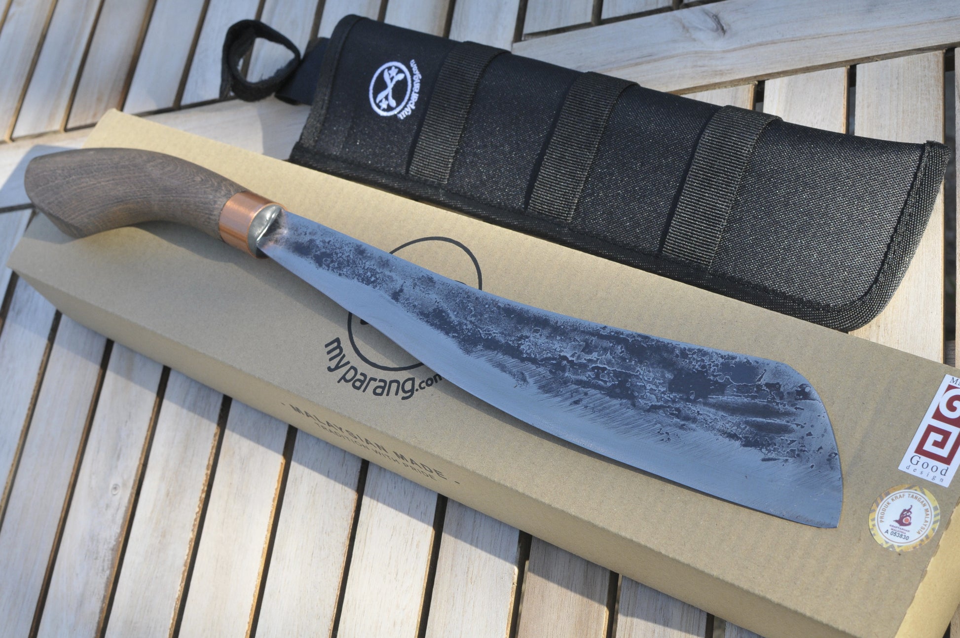 my parang knife on a wooden surface with packaging